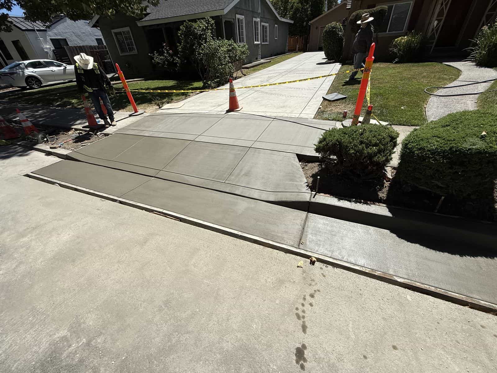 Concrete driveway apron being replaced between the sidewalk and street