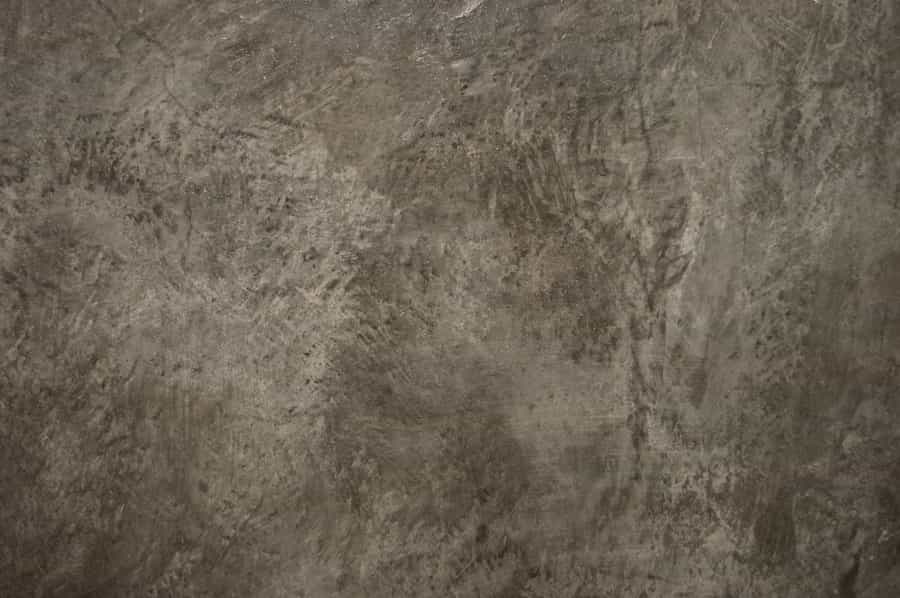 Mottled brown and gray acid-stained concrete surface