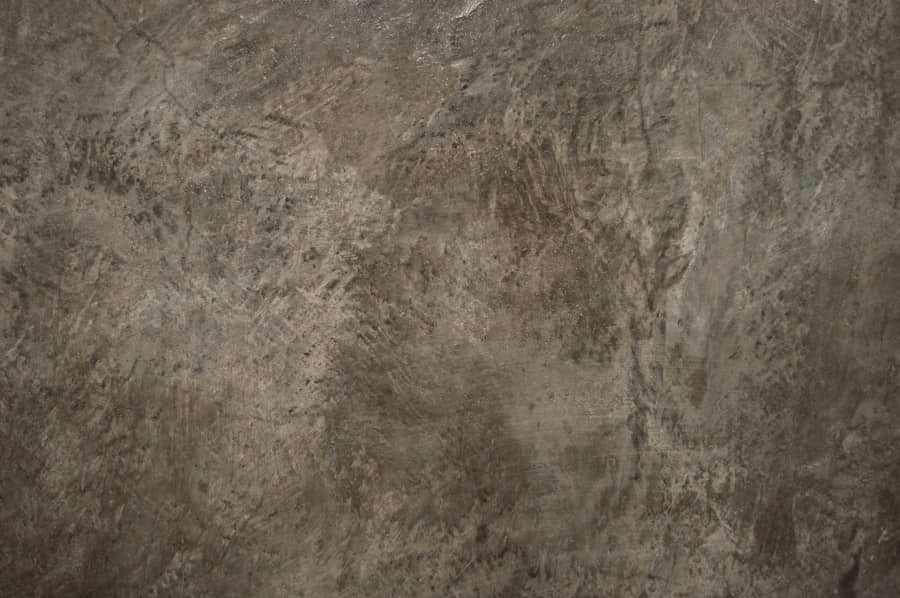 Mottled brown and gray acid-stained concrete surface