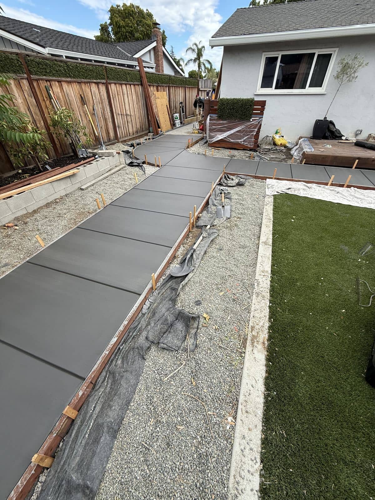Concrete slab mid-cut with a section removed for utility access