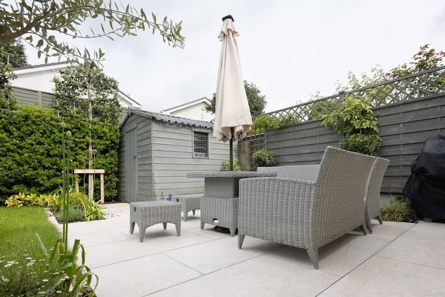 Backyard concrete patio with outdoor furniture