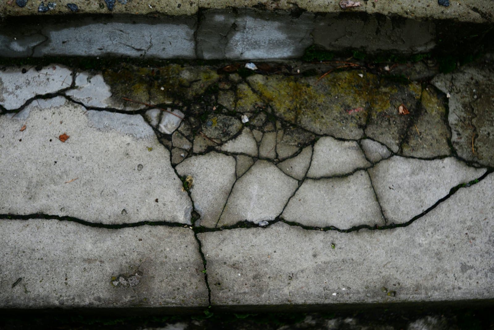 Cracking visible in a concrete foundation wall