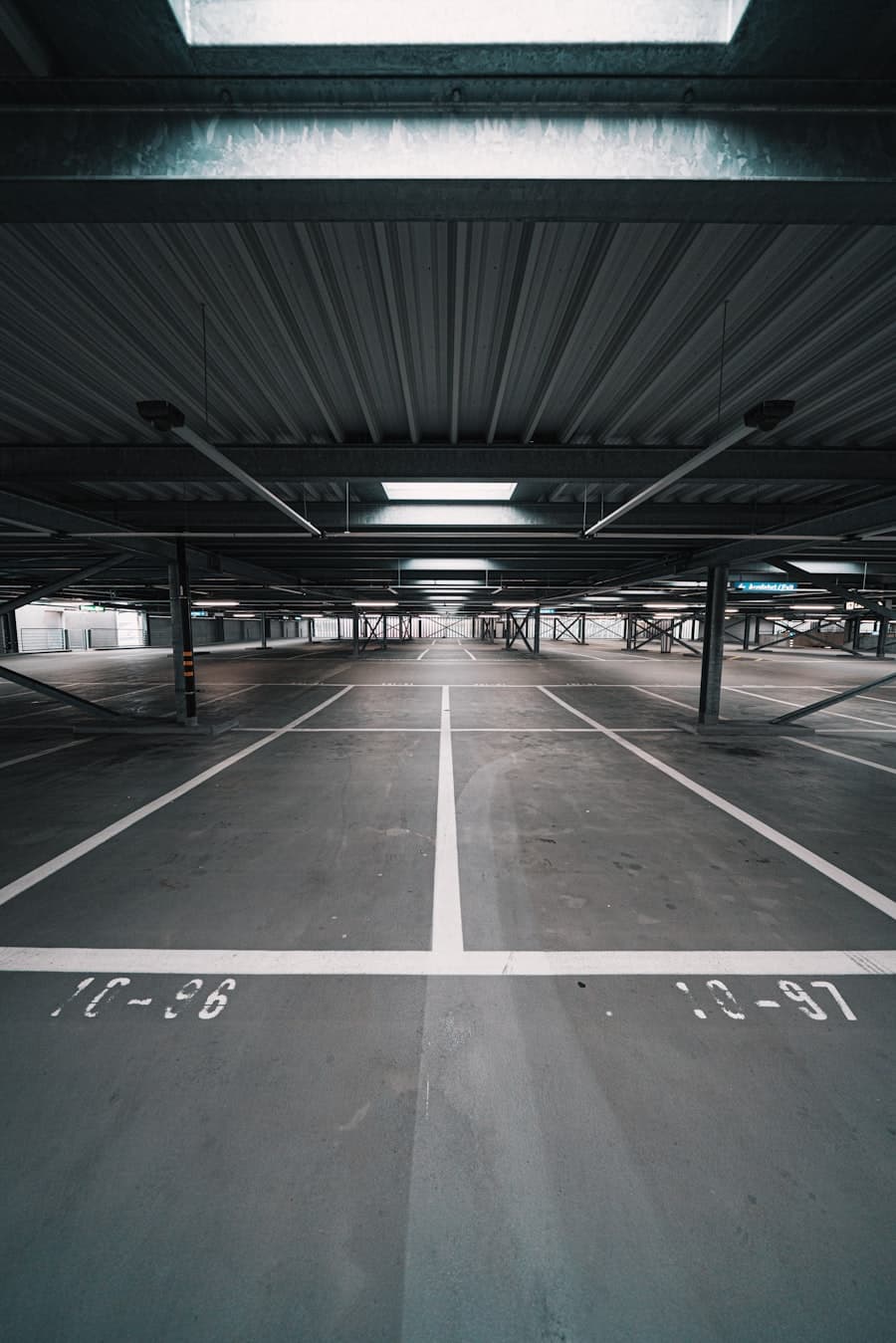 Commercial parking structure with concrete pavement and marked stalls