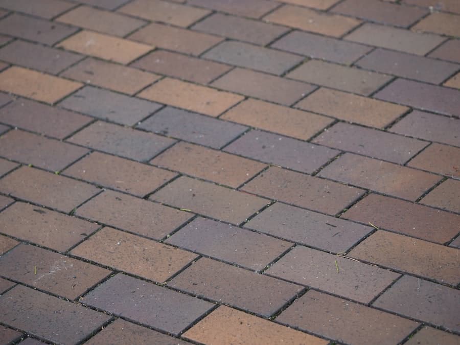 Close-up of herringbone-pattern decorative concrete pavers