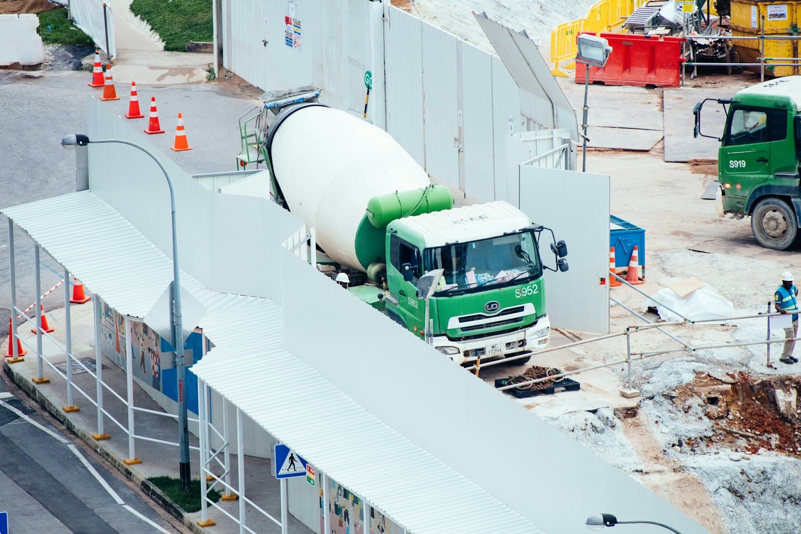 Concrete mixer truck positioned to discharge at a job site