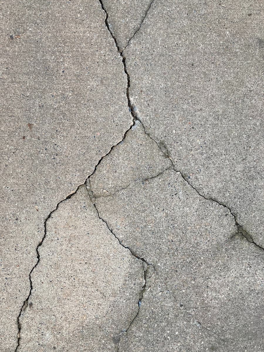 Close-up of a long crack running through a concrete slab