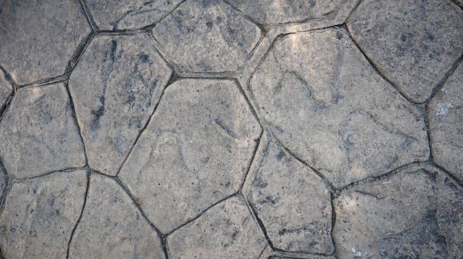 Close-up of stamped concrete cast in an irregular flagstone pattern