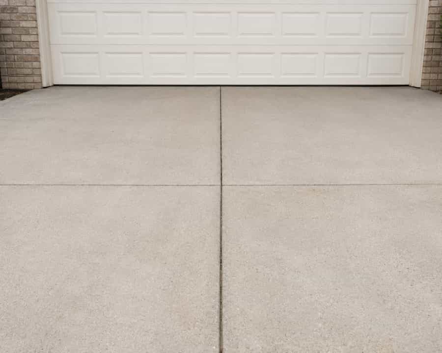 Finished concrete driveway flatwork in front of a home